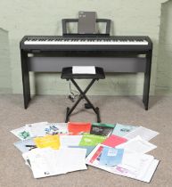 A Yamaha P-35 Digital Piano, on stand with stool, with additional LP5A foot pedal. Complete with