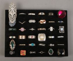 A collection of costume jewellery dress rings. Includes paste set, enamel, wish bone etc.