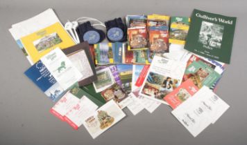 A quantity of Lilliput Lane collectables, including membership booklets, millennium plaques, pens,