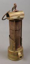 A brass miners Davy lamp, Stamped JM to the top. Possible mark for J.Ullathorn.