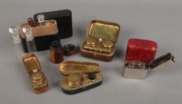 A quantity of travelling inkwells including violin case, wooden turned and leather examples together