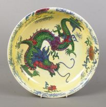 A Bursley Ware 'Dragon' ceramic bowl, decorated with central dragon motif, blue dotted rim and