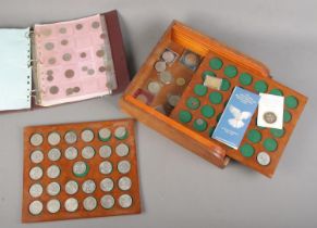 A collection of British coins to include good collection of commemorative crowns along with folder