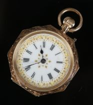 A ladies 14ct gold continental fob watch featuring gilt decorated roman numeral face. 22.42g. In