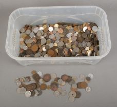 A large collection of assorted world coins to include Victorian Pennies, US dollars, British half