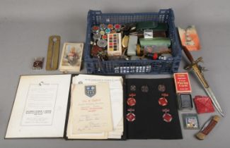 A box of collectables. Includes coins, Dancing medals & certificates, postage weights, dagger with