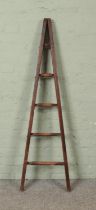 A five rung wooden A-Frame ladder, possibly for fruit picking. Height: 150cm.