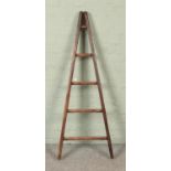 A five rung wooden A-Frame ladder, possibly for fruit picking. Height: 137cm.