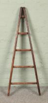 A five rung wooden A-Frame ladder, possibly for fruit picking. Height: 137cm.
