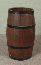 A pine and metal bound barrel Hx63cm