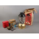 A boxed gold based Tilley Lamp along with boxed Primus No.96 L camping stove.