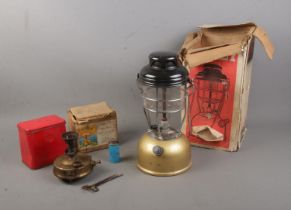 A boxed gold based Tilley Lamp along with boxed Primus No.96 L camping stove.