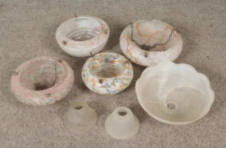 A quantity of vintage light shades, mainly hanging. Chips to orange and pink marbled examples.