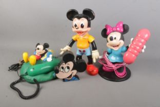 A Mybelle 105 Mickey Mouse telephone together with Minnie mouse example, rubber Mickey Mouse doll