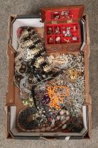 A large tray of costume jewellery including rings, earrings, cufflinks, simulated pearls.