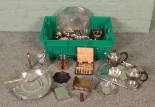 A box of metalwares. Includes silver plate trays, teapots, tankards, hipflasks, etc.