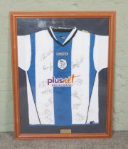 A framed Diadora Sheffield Wednesday shirt from the 2007/2008 season, bearing seventeen players