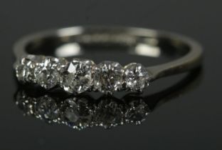 A platinum five stone diamond ring. Size N, 1.8g.
