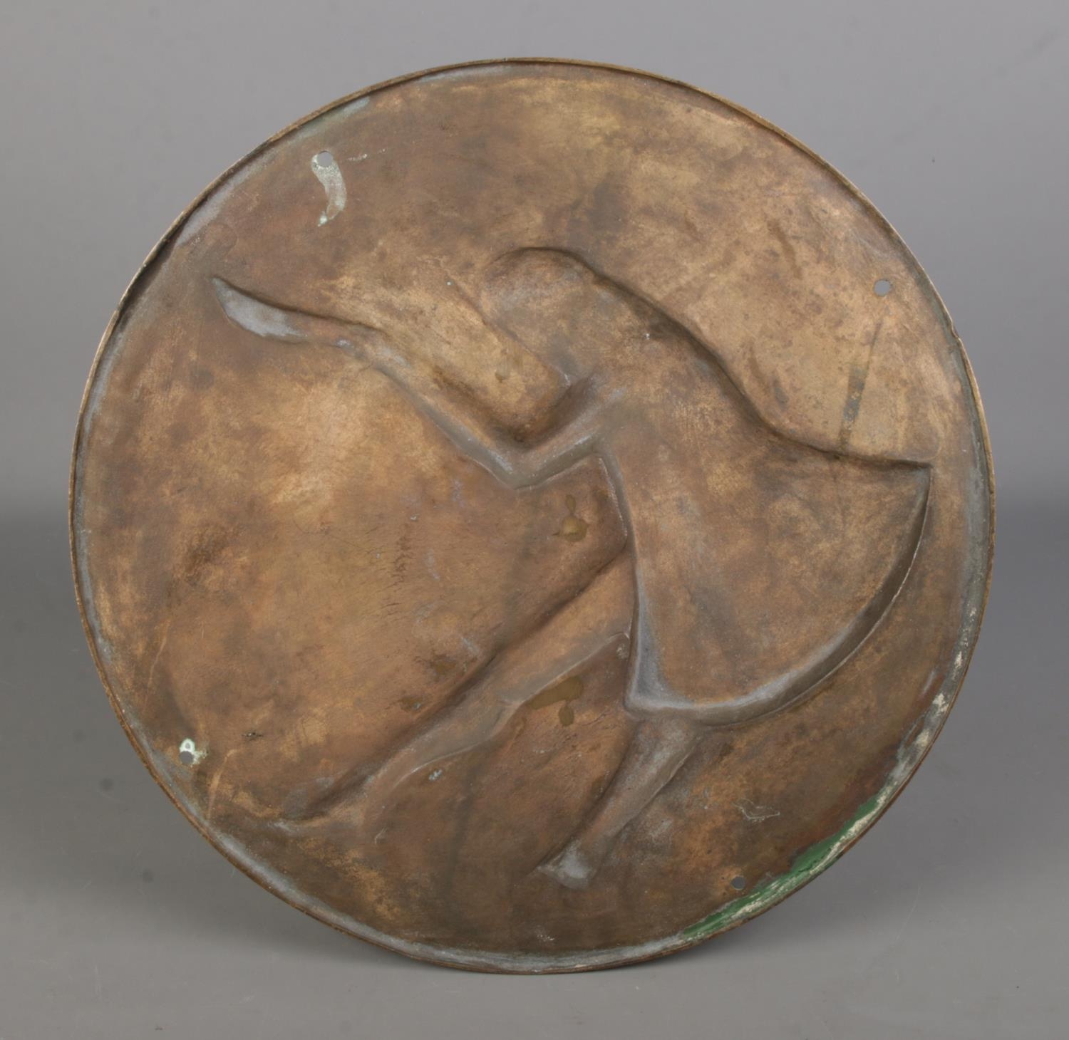 A large circular bronze plaque, depicting a gentleman holding a cane doffing his hat. Diameter: - Image 2 of 2