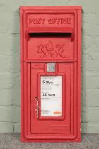 A reproduction red painted post box front. Makers mark for Carron Company, Stirlingshire. 62.5cm x