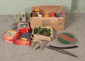 A box of assorted model railway spares, repairs, scenery and accessories to include foliage, card