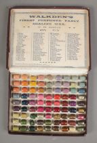 An early 20th century Walkden's Finest Perfumed Fancy Wax display case in 75 shades.