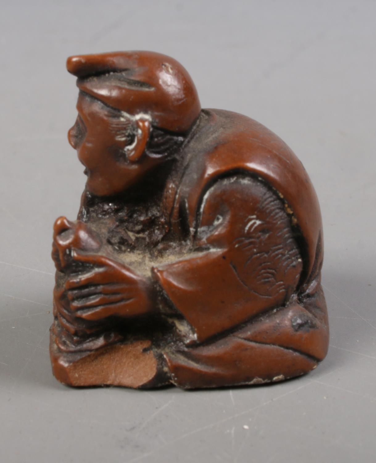 Two Japanese carved hardwood netsukes formed as a gentleman crafting a doll and a gentleman - Image 2 of 2