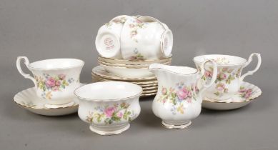 A Royal Albert Moss Rose part tea set containing tea cups, saucers, side plates, milk jug and