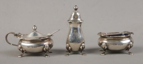 A silver three piece cruet set, assayed Birmingham 1956 by Aide Brothers. Total silver weight: