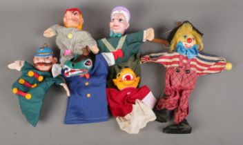 A small collection of vintage puppets to include clown and Punch and Judy examples.
