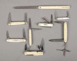 Eight pocket knives with ivorine handles. Includes Encore, George Wostenholm, etc. CANNOT POST