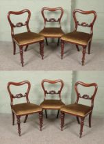 A set of six Victorian mahogany dining chairs.