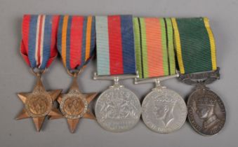 A set of five medals on badge backing, to include 1939-1945 Star, The Burma Star, 1939-1945