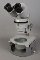 A Nikon binocular microscope No. 73026. Appears to be in working order. No signs of damage.