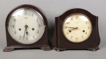 Two Smiths Enfield bakelite clocks. Both in need of restoration