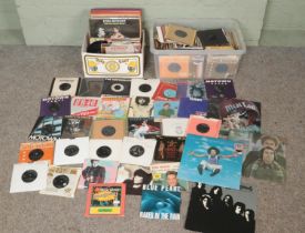 Two boxes of mostly single records. Includes Queen, Elvis, Meat Loaf, UB40, Stevie Wonder, etc.