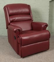 A red leather reclining armchair.