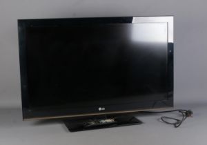 An LG 42" 42LK450U-ZB 1080p TV, with remote. In working order. Some paint splashes to the back.