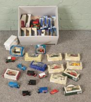 A box of assorted diecast vehicles to include Days Gone, Tetley, Lledo, etc.