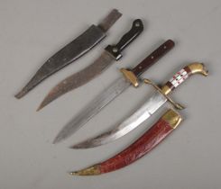 Three daggers. Includes Eastern example with etched blade, Sheffield made example, etc. CANNOT