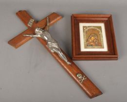 A framed icon plaque along with a large crucifix. Crucifix has signs of woodworm.
