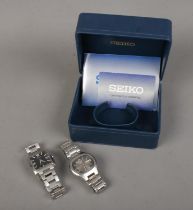 Two men's Seiko watches to include Seiko 5 example and both with date markers. Includes one original