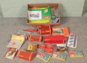 A box of mostly boxed model railway buildings, wagons and accessories to include Hornby, Vollmer,