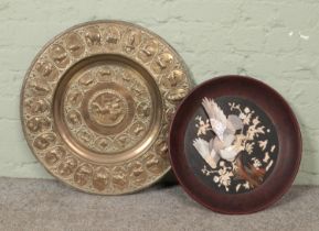 A large Eastern brass plaque/table top along with a Japanese plaque with Shibayama style decoration.