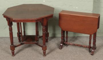 A Victorian mahogany window table along with a Regency style Sutherland table.