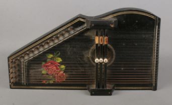 A three bar Auto-Harps featuring rose decoration.