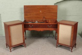 A Dynatron walnut radiogram along with two matching speakers. Having Goldring G101 turntable.