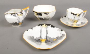 A Shelley Queen Anne Sunset pattern part tea set including cup & saucer, side plate, bowl and jug.