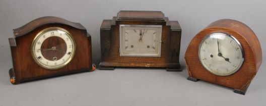Three wooden cased mantel clocks. Includes Enfield, Art Deco example, etc.