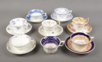 A collection of 19th century porcelain teawares. Includes Rockingham examples with red and puce